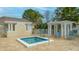 Community hot tub with seating area at 7220 Kensington Ct, University Park, FL 34201