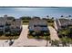 Aerial shot of a house, showcasing its waterfront location and landscaped yard at 73 Tidy Island Blvd, Bradenton, FL 34210