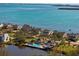 Aerial view of waterfront community with pool and water access at 73 Tidy Island Blvd, Bradenton, FL 34210