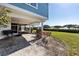 Covered back patio with outdoor seating and tranquil water views at 73 Tidy Island Blvd, Bradenton, FL 34210