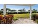 Covered back porch with a waterfront yard and views at 73 Tidy Island Blvd, Bradenton, FL 34210