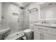 Modern bathroom with a glass shower, marble tile, and floating vanity at 73 Tidy Island Blvd, Bradenton, FL 34210