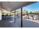 Exterior deck with tables, chairs and a bar area is perfect for outdoor entertaining at 73 Tidy Island Blvd, Bradenton, FL 34210