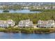 Waterfront townhomes feature lush landscaping and serene water views at 73 Tidy Island Blvd, Bradenton, FL 34210