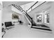 Bright foyer featuring a staircase with black accents and modern decor at 73 Tidy Island Blvd, Bradenton, FL 34210