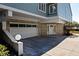 Home featuring a two car garage, brick accents, and an inviting front door at 73 Tidy Island Blvd, Bradenton, FL 34210