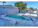 Outdoor hot tub with beautiful tile work, surrounded by lush landscaping and community amenities at 73 Tidy Island Blvd, Bradenton, FL 34210