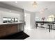 Open kitchen and dining area with sleek wood cabinetry and sliding doors to an outdoor patio at 73 Tidy Island Blvd, Bradenton, FL 34210