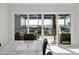 Close-up of sliding glass doors leading to a balcony, showcasing the scenic waterfront view at 73 Tidy Island Blvd, Bradenton, FL 34210