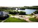 Aerial view of community amenities including a fire pit, gazebo, and waterfront access at 7318 Marathon Dr, Seminole, FL 33777