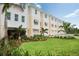 Modern townhouses with attached garages and landscaped lawns at 7318 Marathon Dr, Seminole, FL 33777