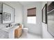 Modern powder room with herringbone tile and a pedestal sink at 7382 Marathon Dr, Seminole, FL 33777