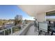 Spacious balcony with partial ocean view and seating area at 775 Longboat Club Rd # 304, Longboat Key, FL 34228