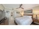 Cozy bedroom with a queen bed and access to a bathroom at 775 Longboat Club Rd # 304, Longboat Key, FL 34228