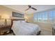 Comfortable guest bedroom with a queen bed and lovely window views at 775 Longboat Club Rd # 304, Longboat Key, FL 34228