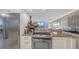 Stainless steel appliances and granite countertops in a well-lit kitchen at 775 Longboat Club Rd # 304, Longboat Key, FL 34228