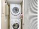 Stackable washer and dryer in a well-lit laundry closet at 775 Longboat Club Rd # 304, Longboat Key, FL 34228