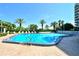 Community pool with ample deck space for sunbathing at 775 Longboat Club Rd # 304, Longboat Key, FL 34228