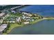 Aerial view of community amenities including pool and tennis at 7872 Mainsail Ln, Sarasota, FL 34240