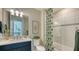 Modern bathroom with shower/tub combo and updated vanity at 7872 Mainsail Ln, Sarasota, FL 34240