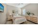 Cozy bedroom with neutral decor, comfortable bed, and stylish nightstands at 7872 Mainsail Ln, Sarasota, FL 34240