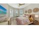 Bright bedroom featuring a comfy bed and large windows at 7872 Mainsail Ln, Sarasota, FL 34240