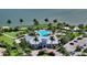 Resort-style pool with clubhouse and palm trees at 7872 Mainsail Ln, Sarasota, FL 34240