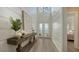 Stylish entryway with shiplap walls and a modern console table at 7872 Mainsail Ln, Sarasota, FL 34240