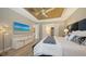 Bright main bedroom with ensuite bathroom access and modern decor at 7872 Mainsail Ln, Sarasota, FL 34240