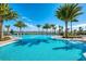 Inviting resort-style pool with palm trees at 7872 Mainsail Ln, Sarasota, FL 34240