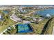 Community aerial view, featuring a clubhouse and pickleball courts at 8112 Slipway Dr, Sarasota, FL 34240