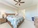 Bright bedroom featuring a king-size bed and built-in drawers at 8112 Slipway Dr, Sarasota, FL 34240