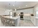 Modern kitchen with white cabinets, a large island, and stainless steel appliances at 8112 Slipway Dr, Sarasota, FL 34240