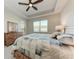 Spacious main bedroom with a large bed, dresser, and ceiling fan at 8112 Slipway Dr, Sarasota, FL 34240