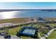 Aerial view of pickleball courts and a lakefront community at 8112 Slipway Dr, Sarasota, FL 34240