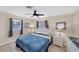 Bedroom with king-size bed, dresser, and ceiling fan at 881 Polaris Rd, Venice, FL 34293