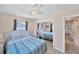 Bedroom with mirrored closet doors and ensuite bathroom at 881 Polaris Rd, Venice, FL 34293