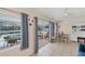 Casual dining area with sliding glass doors leading to the pool at 881 Polaris Rd, Venice, FL 34293