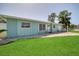 Light blue house with a well-maintained lawn and driveway at 881 Polaris Rd, Venice, FL 34293