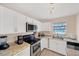 Updated kitchen featuring stainless steel appliances and granite countertops at 881 Polaris Rd, Venice, FL 34293