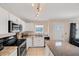 Modern kitchen with granite countertops and white cabinets at 881 Polaris Rd, Venice, FL 34293