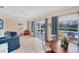 Living room with sliding doors opening to the pool and patio area at 881 Polaris Rd, Venice, FL 34293