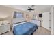 Spacious main bedroom with a comfortable king-size bed and dresser at 881 Polaris Rd, Venice, FL 34293