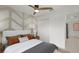 Bedroom with double bed, geometric wall art, and ceiling fan at 9100 Tequila Sunrise Dr, Sarasota, FL 34241