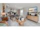 Living room with gray sofa, wooden coffee table, and open floor plan at 9100 Tequila Sunrise Dr, Sarasota, FL 34241