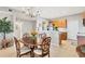 Elegant dining room with a wood table and chandelier at 9203 Griggs Rd # D103, Englewood, FL 34224