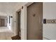 Clean and well-lit hallway with apartment doors at 9203 Griggs Rd # D103, Englewood, FL 34224