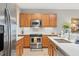 Modern kitchen with stainless steel appliances and an island at 9203 Griggs Rd # D103, Englewood, FL 34224