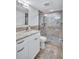 Updated bathroom with granite vanity and walk-in shower at 9393 Midnight Pass Rd # 704, Sarasota, FL 34242