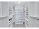 Large walk-in closet with ample shelving and hanging space at 9393 Midnight Pass Rd # 704, Sarasota, FL 34242